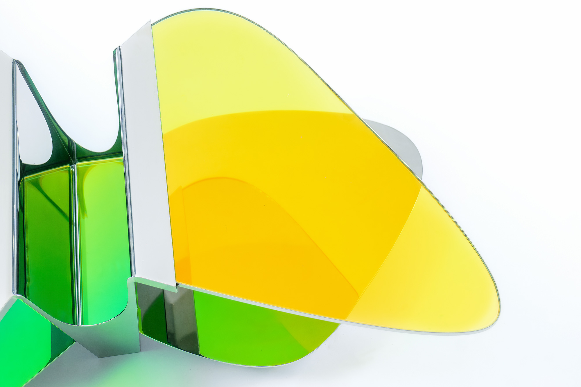 Low Table LT02 by ODA LIK – close-up of polished steel base and curved glass panels